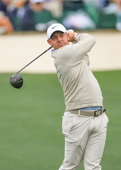 Rory McIlroy follows through on a tee shot during a Masters practice round