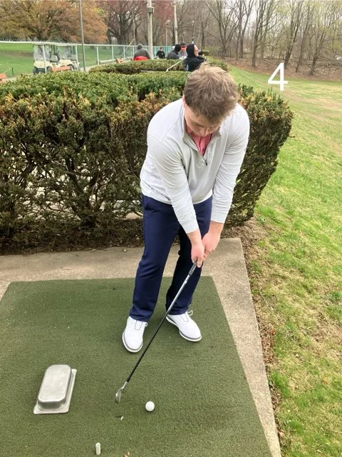 Golfer demonstrating a downward arm swing without wrist hinge